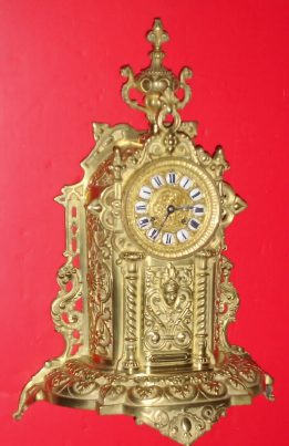 C.1890, French, Brass Cased Clock, in the form of a tabernacle, profusely decorated with twisty columns and geometric designs, and surmounted by similarly decorated urn, the well made movement, with a cast dial with individual cartouche numerals, and original hands. — Antique Clocks Price Guide