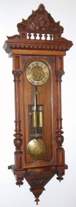 C.1875, Austrian, 2-Wt "Vienna Regulator", in a walnut Alt Deutsch style case, with an old top, and with engraved dial center, weights and pendulum. — Antique Clocks Price Guide