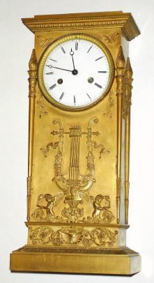 C.1825, French, Lesieur, Gilt Bronze Empire mantel clock, 8-day, bell strike, the case with musical lyre on the front and wreaths to the sides, with a full length torch at each corner. — Antique Clocks Price Guide