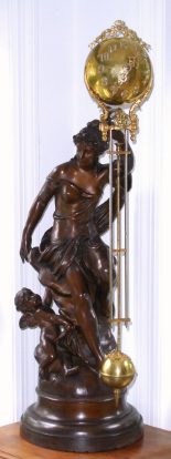 C.1895, Ansonia Clock Co., "FORTUNA", patinated spelter, mysterious swinging timepiece, mother and cherub, the largest swinger in the Ansonia line. — Antique Clocks Price Guide