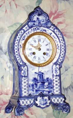 C.1900, French, a Fine Blue Delft Clock, with typical Dutch windmills and sailboats, and a well made rack strike French movement, bearing No. 2600, and with Brocot suspension. — Antique Clocks Price Guide