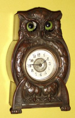 C.1900, German, Animated "Owl" Timepiece (eyes move to center and out again), one day duration, wooden case box with cast and bronzed owl body attached at front. — Antique Clocks Price Guide