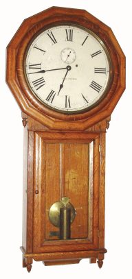 C.1880, Seth Thomas Clock Co., REGULATOR No. 3, in oak, single weight wall clock with 12 sided top bezel, painted dial and pendulum visible through glazed door. — Antique Clocks Price Guide