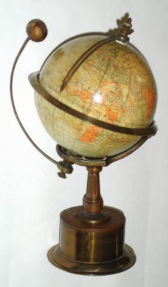 C.1895, French, for Smith and Sons, London, THE EMPIRE CLOCK, small 8-day globe / world time clock, serial 322. A brass ring around the equator shows 24 hours, and a pointer indicates local time for your "home" region. Wind, set and regulate from base. English possessions are shown in light orange, others in ivory color. — Antique Clocks Price Guide