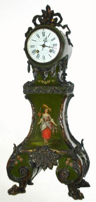 C.1890, French, for J. E. Caldwell, Philadelphia, mini tall case of wood, decorated in the style of Vernis Martin, and profusely accented with bronze trimmings at all corners, and with 4 hairy paw feet. The front of the dark green case has a painting of a young lady with large hat, and the sides are painted with flowers. — Antique Clocks Price Guide