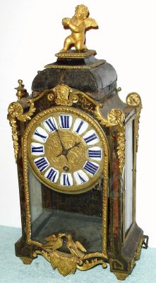 C.1750, French, Massoii, Paris,  Boulle clock with tortoise shell and brass inlay with unique single spring time, qtr strike and repeat movement, with 3 bells atop case. — Antique Clocks Price Guide