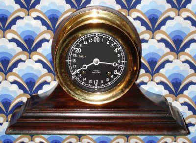 C.1985 Chelsea Clock Co., "The Chelsea" , with rare 4.5" 24 hour black dial/ white hands, eight-day Ship's Bell on a mahogany stand. — Antique Clocks Price Guide