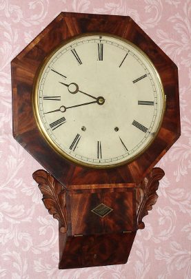 C.1850, Chauncey Jerome, New Haven, Conn, octagonal wall clock with carved side pieces and 8-day time and strike movement with attached fusees. — Antique Clocks Price Guide