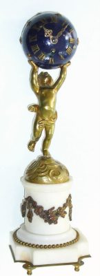 C.1890, French, Ormolu and Marble figural timepiece, a small cherub holding a blue star studded globe aloft, the balance movement in the globe, with rear access. — Antique Clocks Price Guide