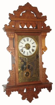 C.1885, E. N. Welch Mfg, Forestville, Conn, ECLIPSE hanging gingerbread in walnut,8-day time, strike and alarm. — Antique Clocks Price Guide