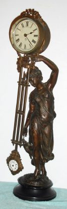 C.1901 Ansonia Clock Co., Huntress swinging arm clock with 4-inch dial pendulum-arm, 8-day timepiece. — Antique Clocks Price Guide