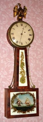 Mixed Banjo, a C.1825 case with early drum style head, with a C.1850 Rhode Island movement. — Antique Clocks Price Guide