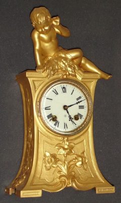 C.1890, Ansonia Clock Co, gilt spelter figural clock of a young boy clad in leaves "Listening". — Antique Clocks Price Guide