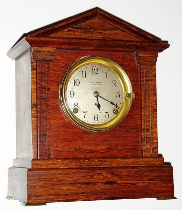 C.1914 Seth Thomas Clock Co., Thomaston, Conn: Sonora Chime Clock No. 5 with mahogany adamantine finish and 8-day time and Westminster chime on four iron bells. — Antique Clocks Price Guide