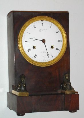 C.1825, French, Charpentier, Paris, month going, bell strike mantel clock, mahogany case with Egyptian motif and silk-suspension movement. — Antique Clocks Price Guide
