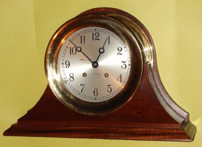 C.1980, Chelsea Clock Co., Boston, 6 inch Ship's Bell on mahogany stand, serial No. 833467, hinged bezel. — Antique Clocks Price Guide