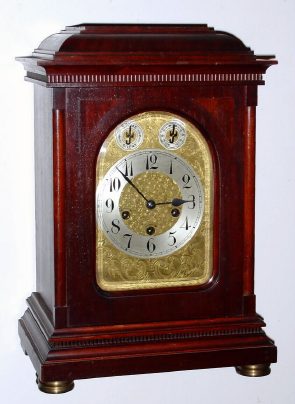 C.1920, German, Junghans, WESTIMINSTER Chime bracket or table clock, in a mahogany case and with embossed brass dial. — Antique Clocks Price Guide