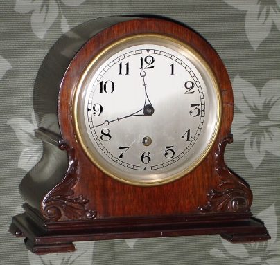 C.1922, Waltham Clock Co., Model 1155, in a balloon style case with carved accents, with Waltham No. 12 time only lever movement, with platform spanning the plates at top. — Antique Clocks Price Guide