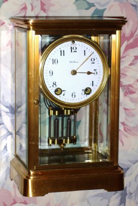 C.1910, Seth Thomas Clock Co., EMPIRE No. 0, in a polished brass, 4-glass case, 8-day time and gong strike. — Antique Clocks Price Guide