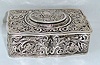 Late 20th Century, German, Singing Bird Box, in a tooled sterling silver case [marked .925 on base], key wound from bottom. 