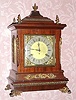 C.1895, New Haven Chime No. 3, Westminster tune, mahogany case with cast trim. This is a nice clean example with all of its applied decorations intact and a clean dial. An auxiliary movement below the striking movement, chimes the quarter hour on four gongs, followed then by strike on larger gong. Three is a patent "echo chamber" in the base of the clock. It has a clean label that was misapplied at the factory as it mis-states this to be the "Abbey" model. This model is pictured on p.96 of Ly's New Haven Clock Book with a 1997 value of $625. 