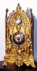 C.1800, Austrian, Zappler with front hung "cows tail" pendulum, the dial affixed to a gilt facade, flanked by two figures, and a shield below, and with a later glass dome. 