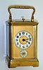 C.1900, French, Brass Cased Carriage Clock, Miniature case, 8-day time, qtr strike [petite sonnerie] and with alarm, in a Corniche case, round porcelain dials on a gilt mask. 