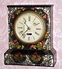 C.1852, S. B. Terry, 30-hour Torsion timepiece, in a mini iron case with MOP inlays and painted flowers. 