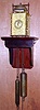 C.1870, Japanese Lantern clock, time, strike and alarm, weight driven, balance regulated, and with calendar apertures below 5 and 7, and with a gilt brass case, fretted to both sides and the rear, plus later wall bracket. 