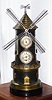 C.1880, French, Guilmet, Paris, "WINDMILL", clock from the Industrial series, a timepiece movement in the tower, and the mill blades turned via a cord travelling up the tower from a separate movement in the base, and wound by opening the "door of the mill", and with an Aneroid barometer above the clock. 