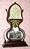 C.1848 J.C. Brown, Bristol, Conn., full-size acorn clock with side arms and signed 8-day time and strike remote fusee movement. 