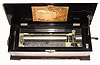 C.1890, Mermod Freres, St. Croix, Switzerland, ten tune music box with original tune sheet; longer running spring with Jacot Safety Check and tune indicator to the left. 14.5" wide cylinder, double comb, Sublime Harmony. Key wound from the right side of the box. 