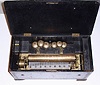 C.1875, Swiss, 8-tune, Bells in sight music box in need of restoration, 80 teeth in main comb, 6 in bell comb, cylinder is 13 inches 