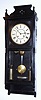 C.1883 Seth Thomas Clock Co., Thomaston, Conn: "Flora" model wall clock in ebony finish with 8-day time and strike weight movement. 