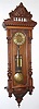 C.1875, Austrian, 2-Wt "Vienna Regulator", in a walnut Alt Deutsch style case, with an old top, and with engraved dial center, weights and pendulum. 