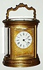 C.1880, French, Brass Cased Carriage Clock, Larger Oval, fully engraved including handle and dial mask, time strike and repeat, 8-day. 