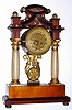 C.1830, Austrian portico shelf clock. Mahogany with silver-metal inlay, ebony trim and alabaster columns with 1-2 day time and strike silk-suspension movement.. 