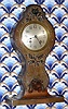 C.1911, Chelsea Clock Co., 4 1/4" dial, art nouveau metal and wood case in "Hunter" motif, with 8-day Ship's Bell movement. 