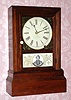 C.1850, J.C. Brown, Bristol, CT. U.S., rosewood cottage clock with an 8-day time and strike movement. 