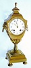 C.1825, French, Ormolu Mantel Clock in the stylized from of an urn, with lion and grape trim to the aides, and with a porcelain dial signed: "H. Laresche, Paris". 