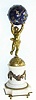 C.1890, French, Ormolu and Marble figural timepiece, a small cherub holding a blue star studded globe aloft, the balance movement in the globe, with rear access. 