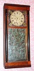 C.1835 Unsigned Mirror Clock,  Column and flat top case with 8-day time and strike brass weight movement. 