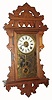 C.1885, E. N. Welch Mfg, Forestville, Conn, ECLIPSE hanging gingerbread in walnut,8-day time, strike and alarm. 