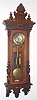 C.1880, German, Gustav Becker, 2-Wt, Vienna Regulator, in a carved Alt Deutsch case, the later movement on a wooden slide mounting to the sides of the case, and with old top. 