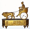 C.1830, French Ormolu figural clock, small. 8-day time and strike silk-suspension movement, a lion pulling a chariot with female driver. 