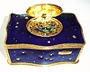 Late 20th Century, German, Singing Bird box, in a gilt and blue enamel case with gold stars showing through blue-stars on all sides, key wound from base. 