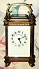 C.1900, French for Tiffany, Carriage Timepiece, in an unusual brass case with reeded columns, cast French feet, pineapple finials and bands of acanthus leaves around top and bottom. 
