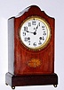 C.1900, Vermont Clock Co., Fairhaven, VT, mahogany cased mantel clock, 8-day time and gong strike, case with cross banded edge inlay and a central fan, possibly cased by Jennings Brothers whose logo is on dial.. 