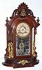 C.1880 Ansonia Clock Co., Ansonia, Conn: TRIUMPH model walnut mirror-side shelf clock with 8-day time and strike movement. 