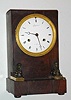 C.1825, French, Charpentier, Paris, month going, bell strike mantel clock, mahogany case with Egyptian motif and silk-suspension movement. 